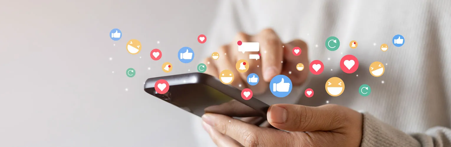 adult hand holding a smartphone and using social media