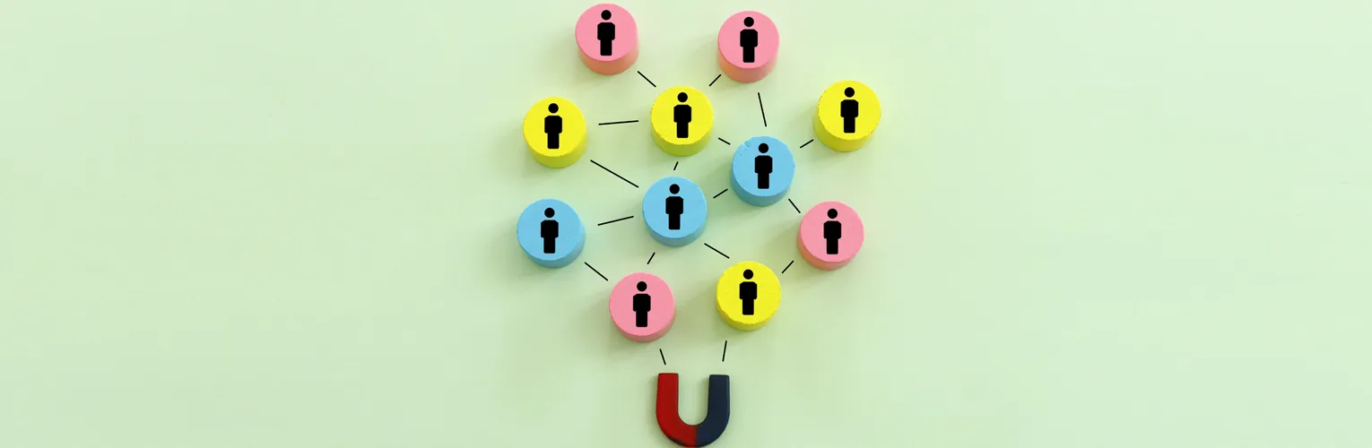 Magnet attracting people, symbolising social media influence