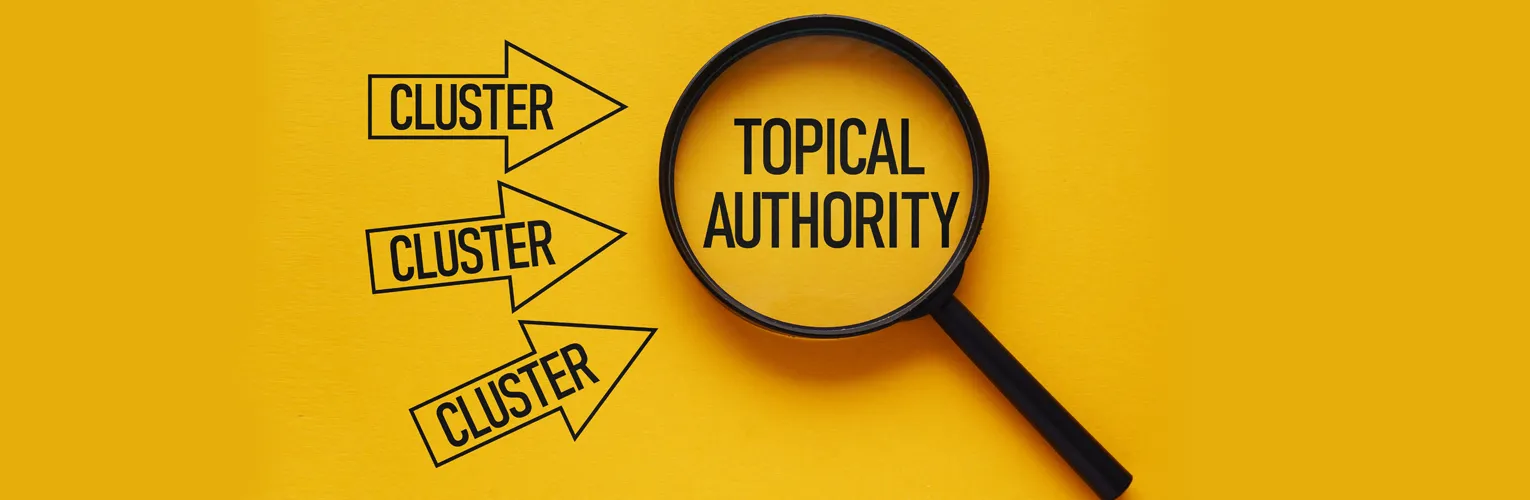 Magnifying glass over the text "topical authority"