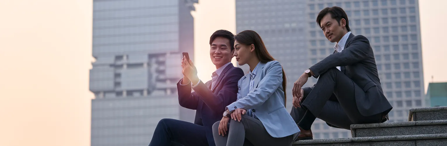 Asian executives using smartphones